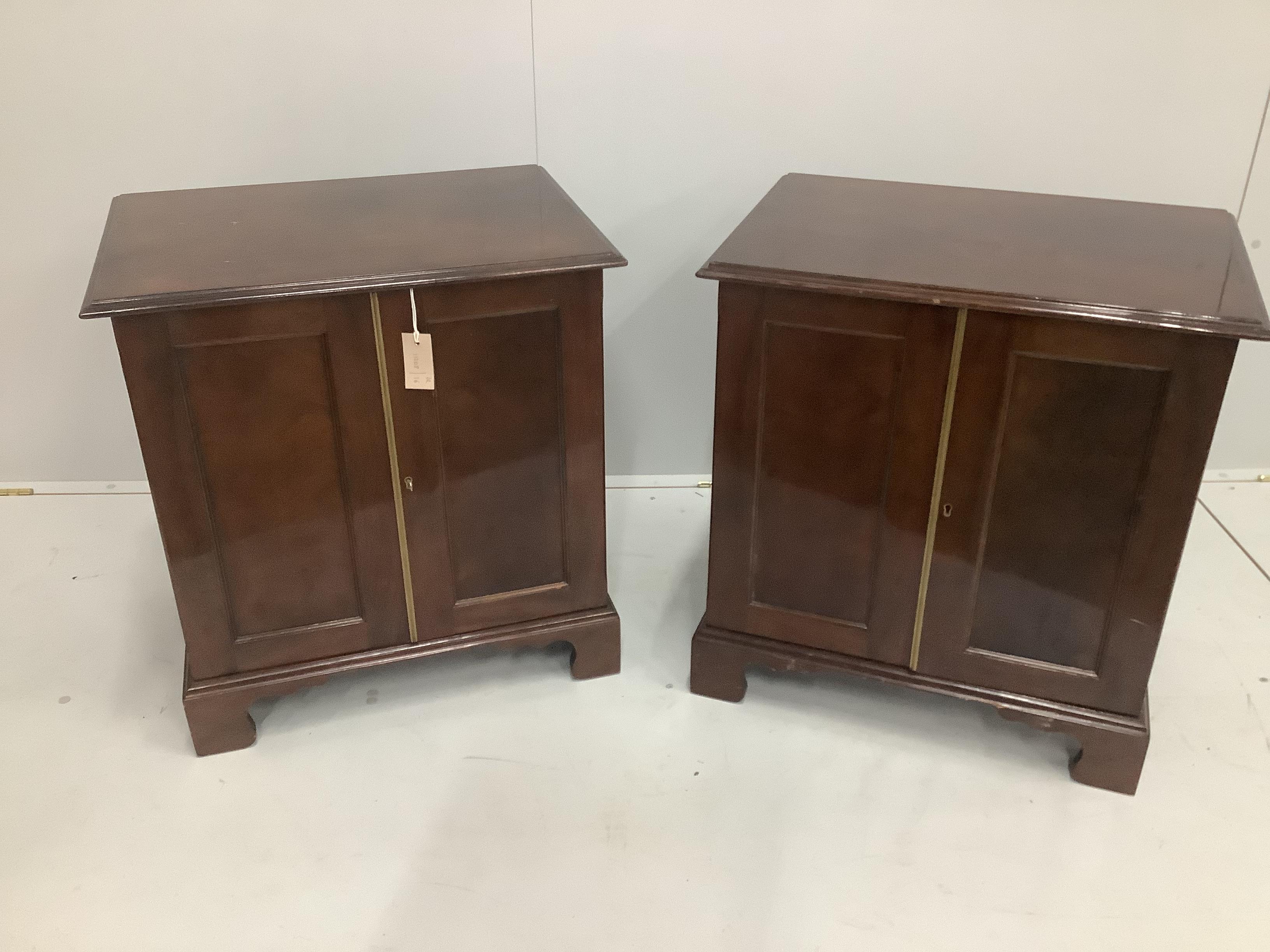 A pair of George III style mahogany side cabinets, width 61cm, depth 45cm, height 65cm